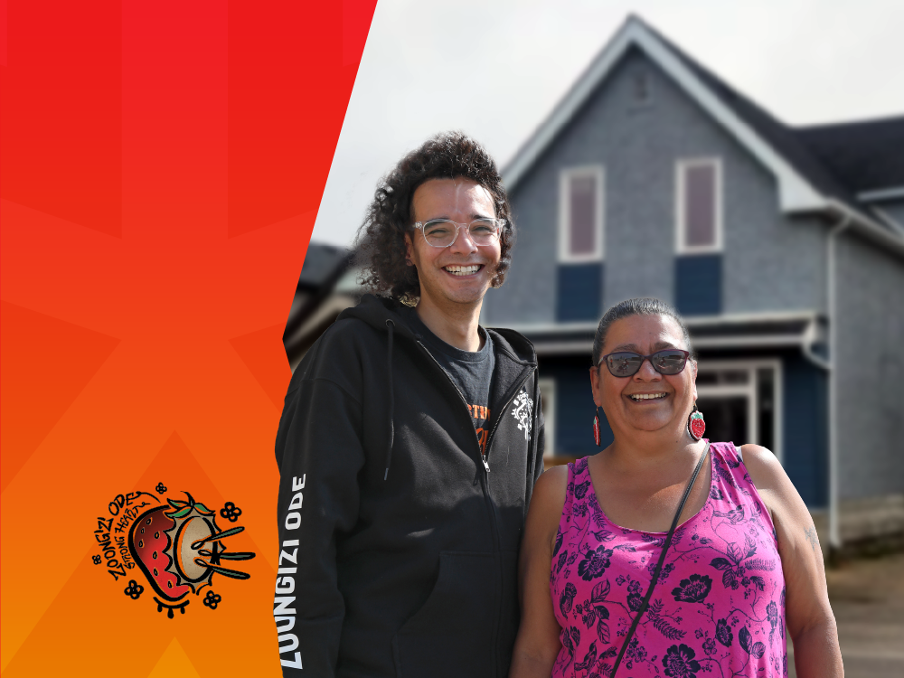 Mary Burton and Michael Champagne in front of Butterfly Lodge