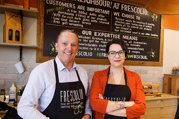 The owners of Frescolio oil sommelier at one of the stores in Winnipeg